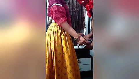 Indian stepsister in black dress and stockings is giving handjob
