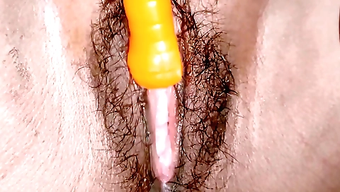 Hairy indian girl is on her knees with a hairy pussy