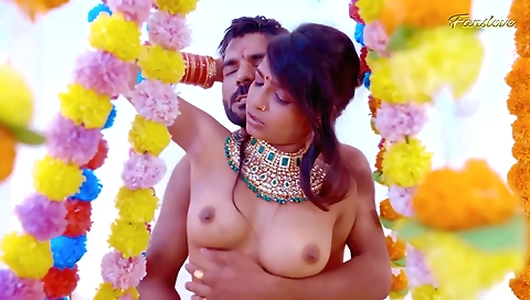 Indian girl in a dress and stockings is having a great wedding night
