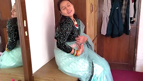 Dressed on the bed naked is an amateur indian girl