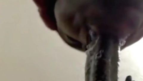 Busty brunette with a round ass is making a deepthroat blowjob