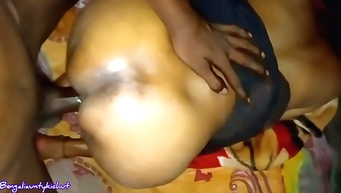 Indian brunette in a black suit gives a handjob in a video