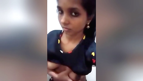 Indian brunette in sexy boots shows her boobs on webcam