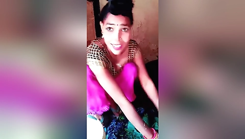 Wife in a black blouse and a black skirt in the village
