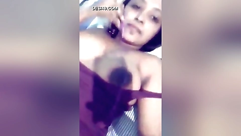 Busty brunette in sexy outfit shows her hairy pussy