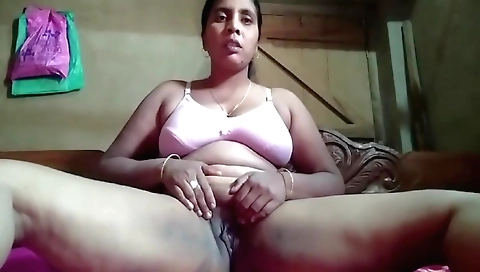 Indian wife touches and fingers husband's cleft on the couch