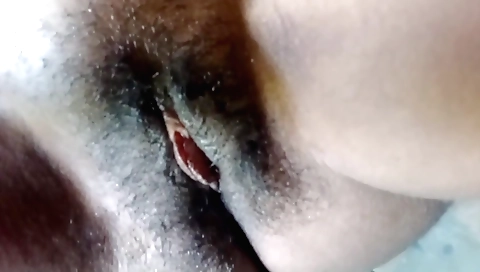 Hairy girl in bed masturbates to make her pussy hot today