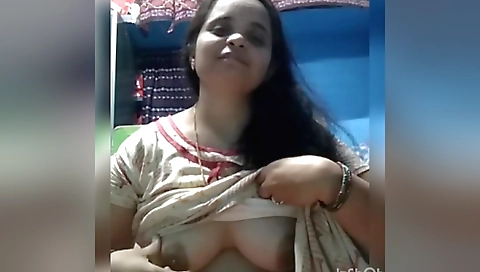 Indian milf shows her boobs to her lover on webcam