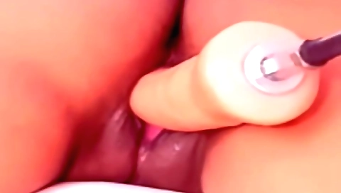 Solo female masturbates with a vibrator and a dildo