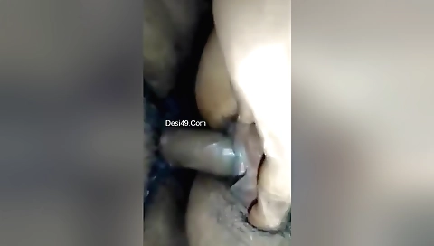 Indian woman takes off top and plays with her hairy pussy