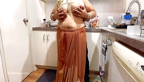 Indian big ass babe with big tits and a nice ass in the kitchen